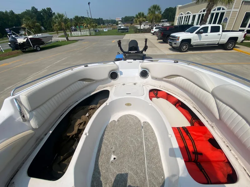 Slide: The Image of 2009 Starcraft 2410 OB Limited boat interior with seating and storage compartments. - 18