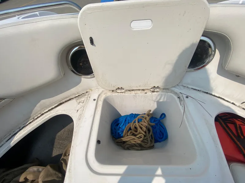 Slide: The Image of Storage compartment of a 2009 Starcraft 2410 OB Limited boat with ropes inside. - 19