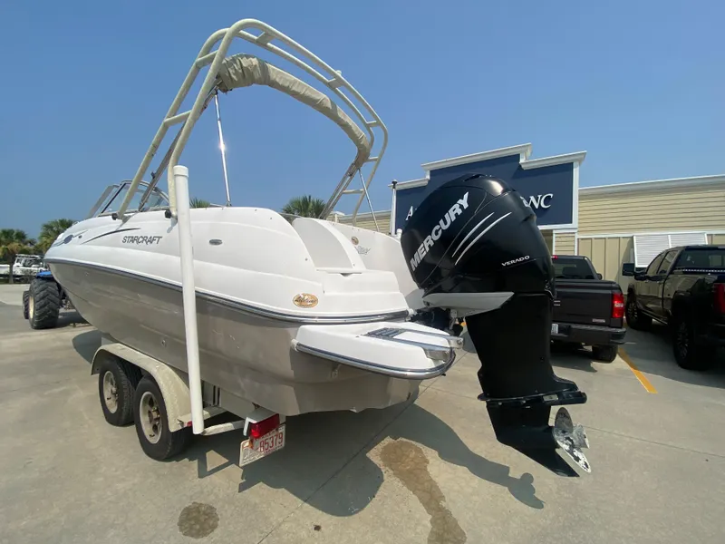 Slide: The Image of 2009 Starcraft 2410 OB Limited boat with Mercury outboard motor on trailer. - 2