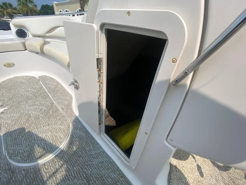Slide: The Image of Open storage compartment on a 2009 Starcraft 2410 OB Limited boat. - 20