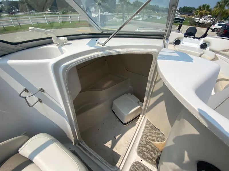 Slide: The Image of 2009 Starcraft 2410 OB Limited boat interior with storage compartment. - 21
