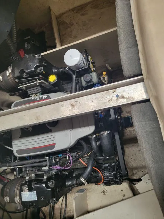 Slide: The Image of 2011 Sea Ray 195 Sport engine compartment with visible components. - 17