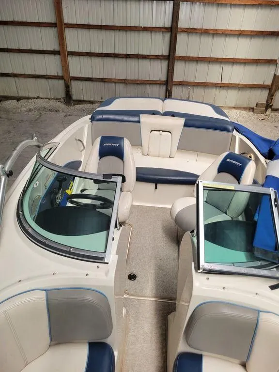 Slide: The Image of 2011 Sea Ray 195 Sport boat interior with blue and white seating. - 20