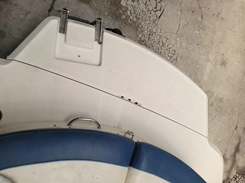 Slide: The Image of 2011 Sea Ray 195 Sport boat stern with blue and white seating. - 22