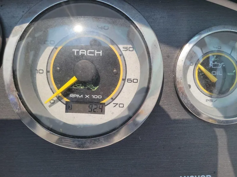 Slide: The Image of Close-up of 2011 Sea Ray 195 Sport tachometer and oil gauge. - 5