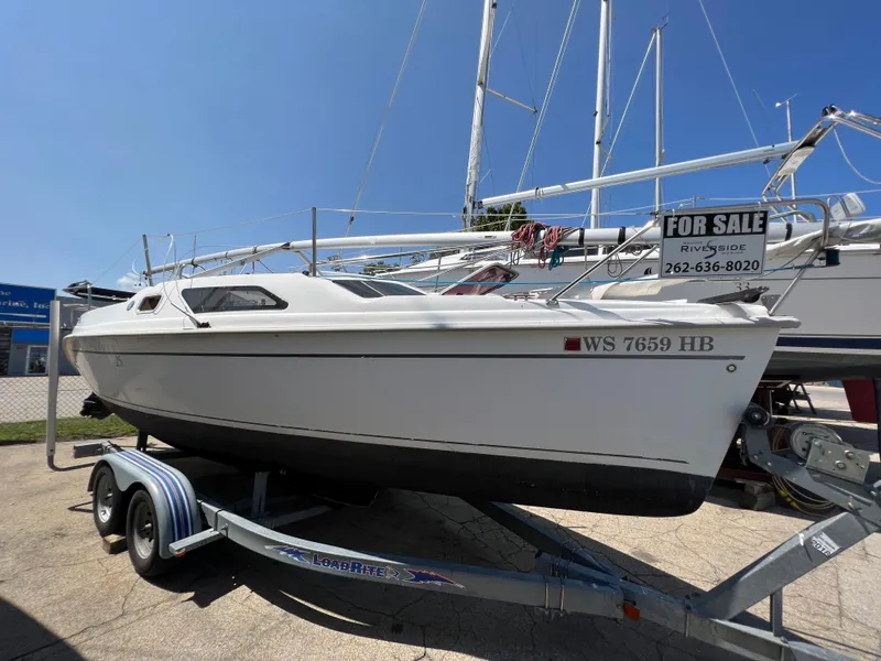 The Image of 2007 Hunter 25 sailboat on trailer, for sale, sunny day. - 0