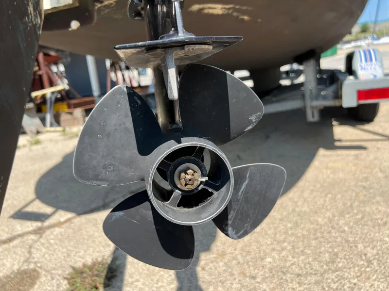 Slide: The Image of Close-up of a 2007 Hunter 25 boat propeller on a trailer. - 13