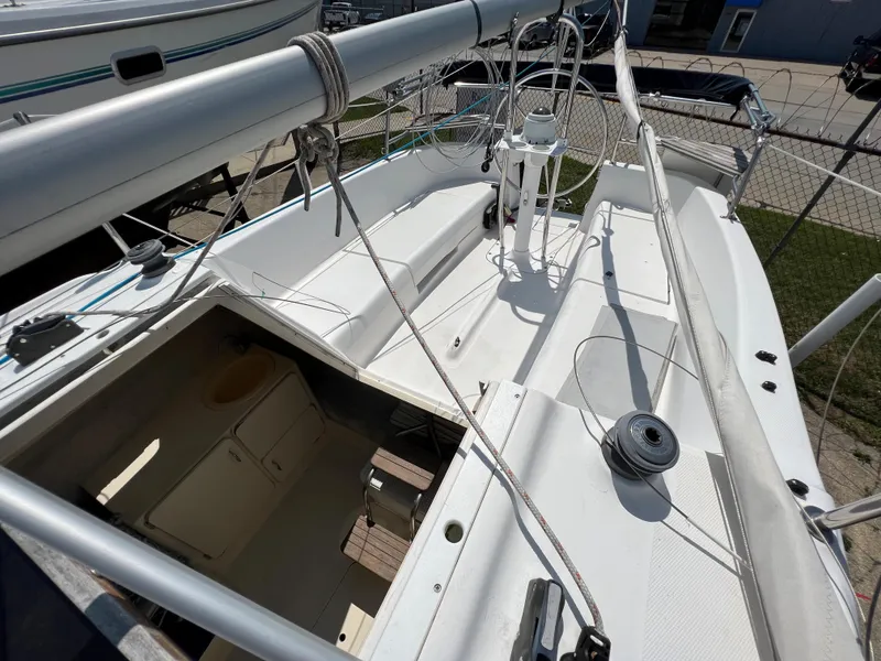 Slide: The Image of 2007 Hunter 25 sailboat deck and cabin view, showcasing rigging and interior access. - 21