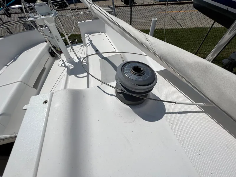Slide: The Image of 2007 Hunter 25 sailboat deck with winch and rigging. - 25