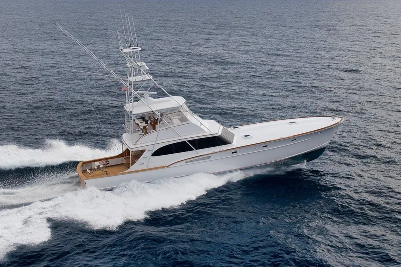 The Image of 2001 Rybovich Sportfisherman yacht cruising on open ocean waters. - 0