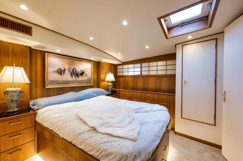 Slide: The Image of Luxurious cabin interior of a 2001 Rybovich Sportfisherman yacht with elegant wood paneling. - 13