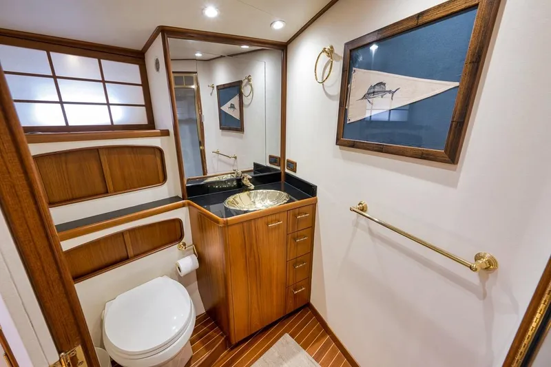 Slide: The Image of Luxurious bathroom on 2001 Rybovich Sportfisherman yacht with wood accents and elegant fixtures. - 15