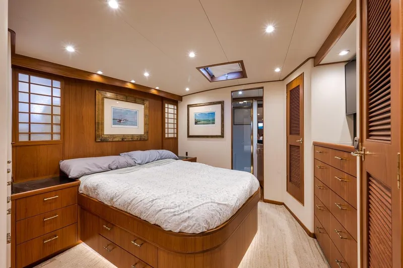 Slide: The Image of Luxurious cabin interior of a 2001 Rybovich Sportfisherman yacht with elegant wood finishes. - 16