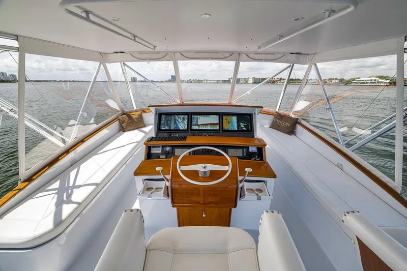 Slide: The Image of Helm of 2001 Rybovich Sportfisherman boat with navigation screens and ocean view. - 19