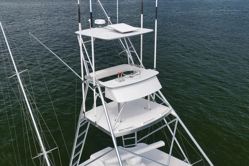 Slide: The Image of Rybovich Sportfisherman 2001 boat tower against ocean backdrop, showcasing sleek design and structure. - 24