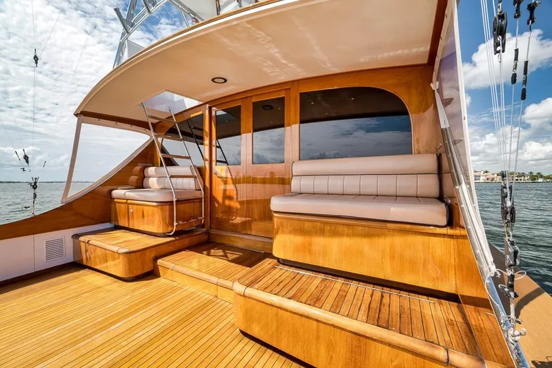 Slide: The Image of Luxurious 2001 Rybovich Sportfisherman yacht with elegant wooden deck and cushioned seating. - 28