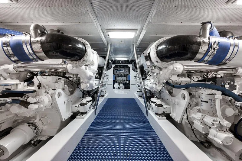 Slide: The Image of Engine room of a 2001 Rybovich Sportfisherman, showcasing dual powerful engines. - 35
