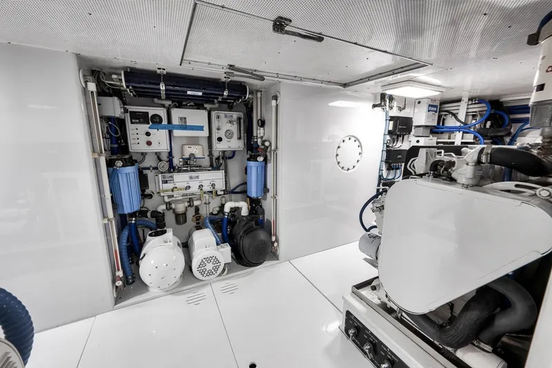 Slide: The Image of Engine room of a 2001 Rybovich Sportfisherman, showcasing advanced marine equipment and systems. - 36