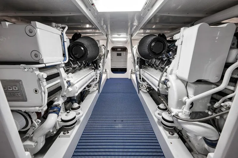 Slide: The Image of Engine room of a 2001 Rybovich Sportfisherman, showcasing dual powerful engines. - 37