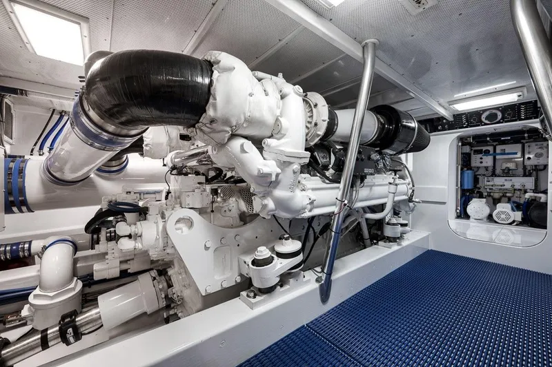 Slide: The Image of Engine room of a 2001 Rybovich Sportfisherman, showcasing advanced marine machinery and equipment. - 38