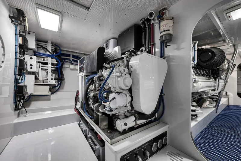 Slide: The Image of Engine room of a 2001 Rybovich Sportfisherman, showcasing advanced marine machinery. - 40