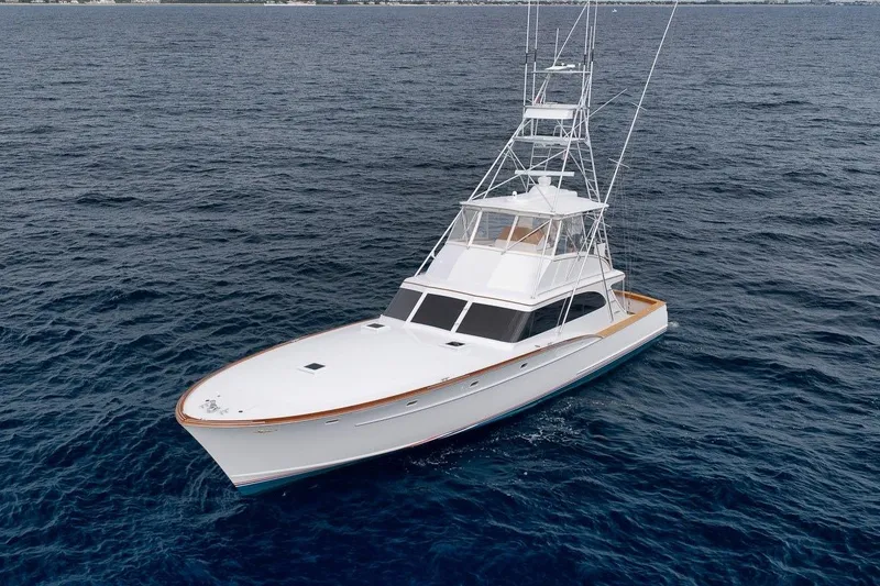 Slide: The Image of 2001 Rybovich Sportfisherman yacht cruising on open ocean waters. - 44