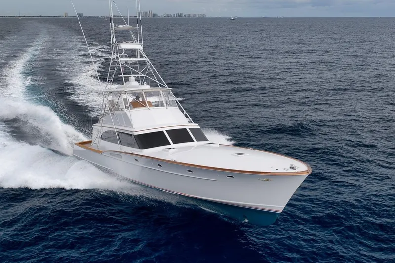 Slide: The Image of 2001 Rybovich Sportfisherman yacht cruising on open ocean waters. - 47