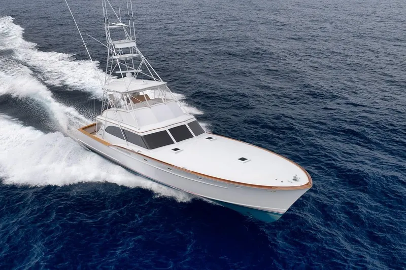 Slide: The Image of 2001 Rybovich Sportfisherman yacht cruising on open ocean waters. - 49