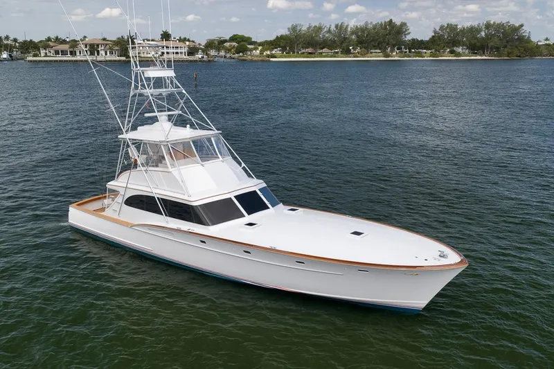 Slide: The Image of 2001 Rybovich Sportfisherman yacht on calm water, showcasing sleek design and craftsmanship. - 50