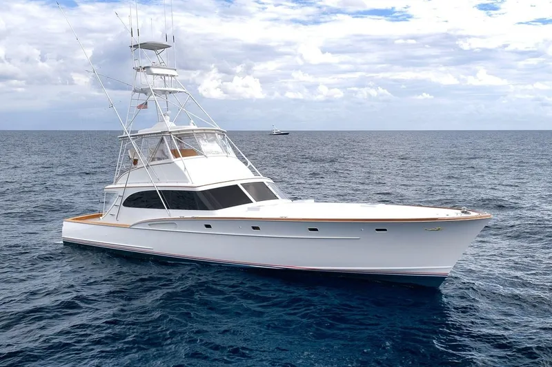 Slide: The Image of 2001 Rybovich Sportfisherman yacht on open sea under cloudy sky. - 51