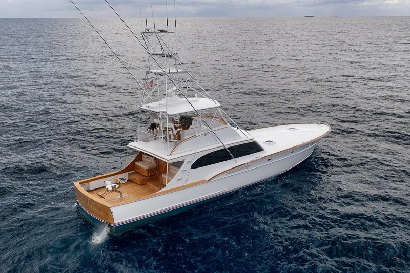 Slide: The Image of 2001 Rybovich Sportfisherman yacht cruising on open ocean waters. - 52