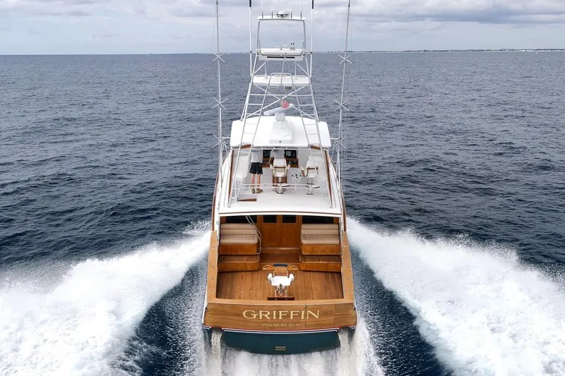 Slide: The Image of 2001 Rybovich Sportfisherman yacht cruising on open sea, rear view. - 53