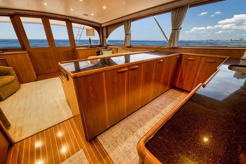 Slide: The Image of Luxurious interior of 2001 Rybovich Sportfisherman yacht with wooden cabinetry and ocean view. - 6