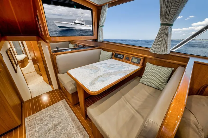 Slide: The Image of Luxurious 2001 Rybovich Sportfisherman yacht interior with elegant wood finishes and ocean view. - 8