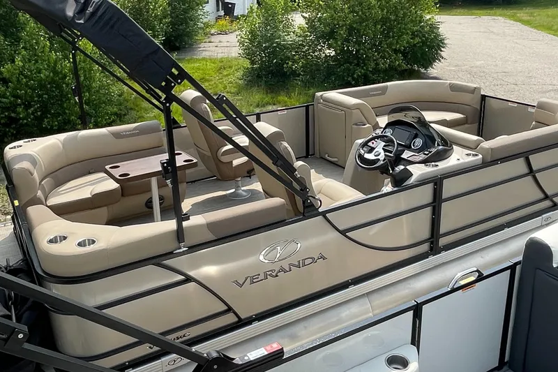 Slide: The Image of 2024 Veranda VR20RC pontoon boat with luxurious seating and modern helm. - 0