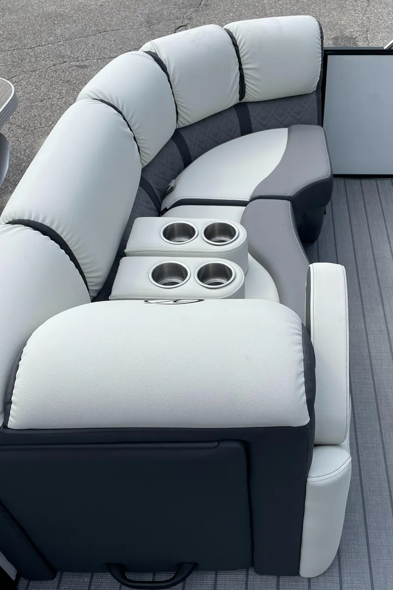 Slide: The Image of 2024 Veranda VP 22RC pontoon boat with plush seating and cup holders. - 2