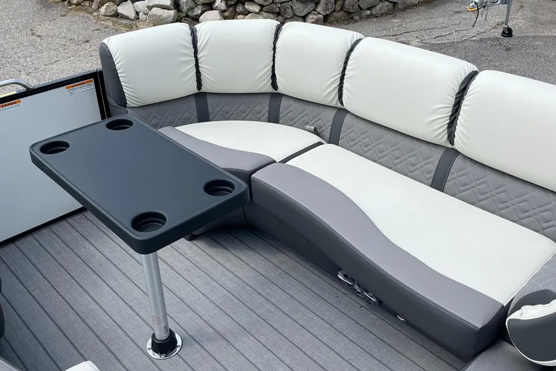 Slide: The Image of 2024 Veranda VP 22RC boat interior with cushioned seating and table. - 3