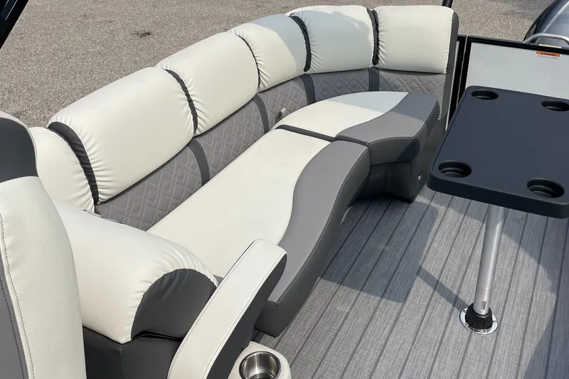 Slide: The Image of 2024 Veranda VP 22RC boat interior with cushioned seating and table. - 5