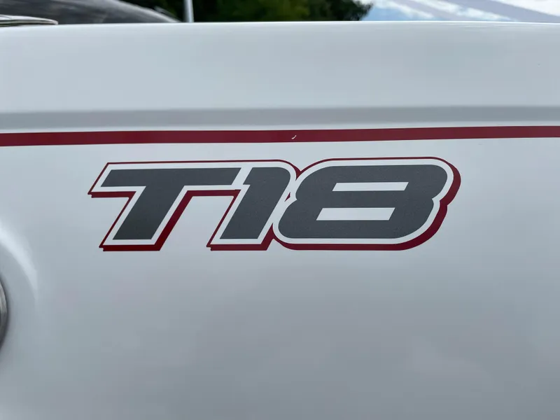 Slide: The Image of 2024 Tahoe T18 boat model logo on white surface - 9