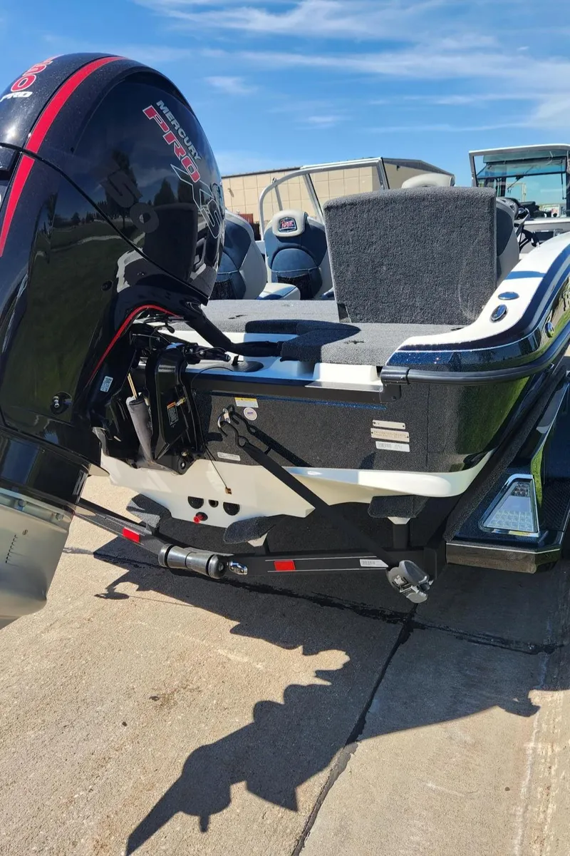 Slide: The Image of 2024 Ranger 1850MS boat with powerful outboard motor on a sunny day. - 3