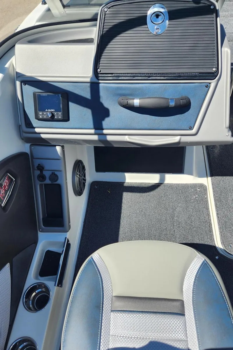 Slide: The Image of 2024 Ranger 1850MS boat interior dashboard and seating area. - 5