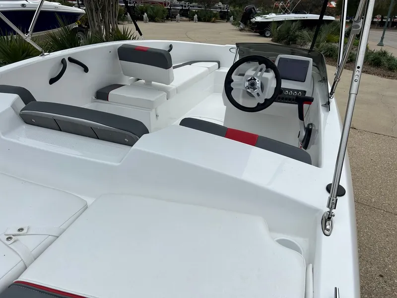 Slide: The Image of 2024 Tahoe T16 boat interior with steering wheel and seating. - 1