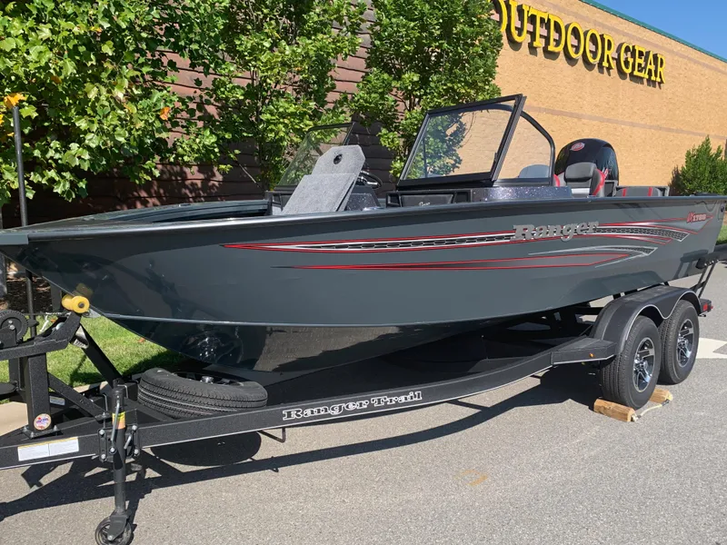 The Image of 2023 Ranger VX1788 WT boat on trailer outside outdoor gear store. - 0