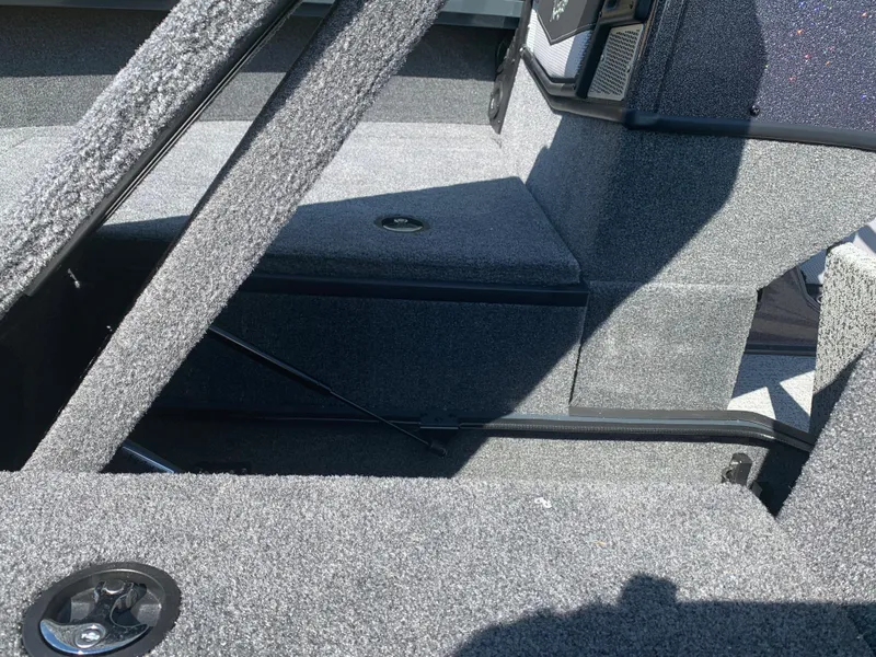 Slide: The Image of 2023 Ranger VX1788 WT boat interior with carpeted storage compartments. - 3