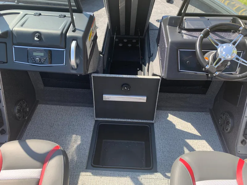 Slide: The Image of 2023 Ranger VX1788 WT boat interior with storage compartment and steering console. - 6