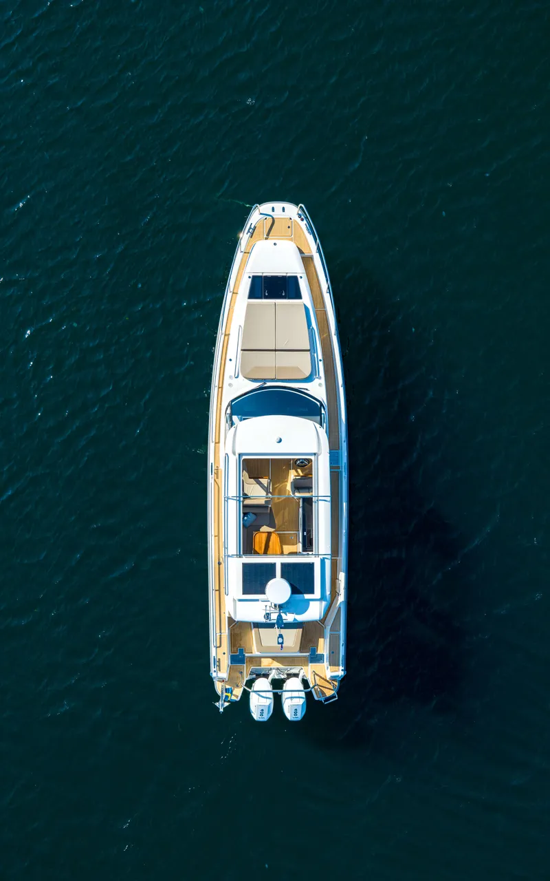 Slide: The Image of Aerial view of 2024 Nimbus Weekender 11 yacht on open water. - 37