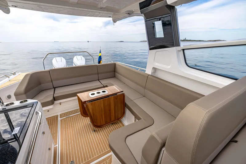 Slide: The Image of Luxurious interior of 2024 Nimbus Weekender 11 yacht with spacious seating and ocean view. - 43