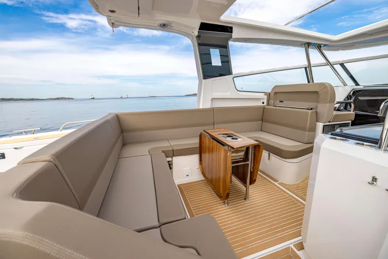 Slide: The Image of Luxurious interior of 2024 Nimbus Weekender 11 yacht with elegant seating and ocean view. - 44