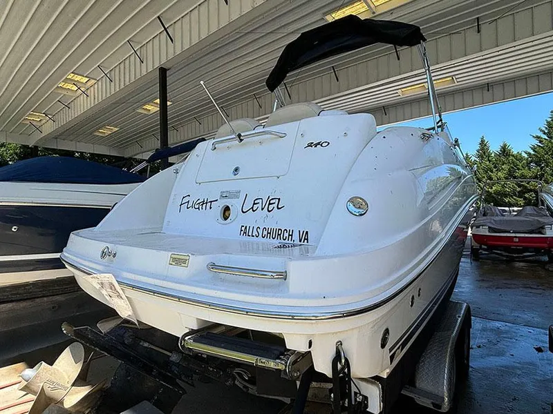 Slide: The Image of 2008 Sea Ray 240 Sundancer boat in a covered storage area. - 4