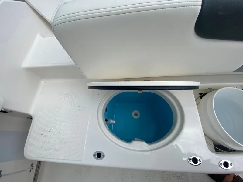 Slide: The Image of 2026 Robalo 202 EXPLORER boat seat with built-in storage compartment. - 10
